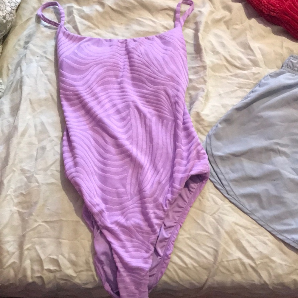 Woman’s purple tiger style print body suit